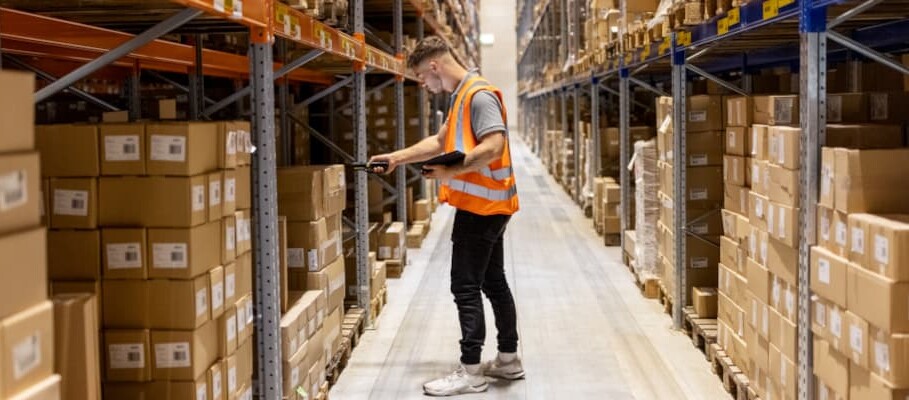 warehouse worker scanning package